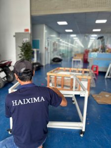 Máy ép keo Haixima căn biên cơ